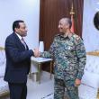 Burhan and Idris shake hands