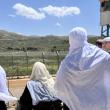 Syrian Druze women look across the Golan border into Israel - source: Reuters