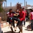 Photo of Syrian medics evacuating injured troops after violent clashes in Suwayda province..