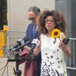 Iranian dissident Masih Alinejad speaks addresses a crowd at a courthouse - source: Holly Dagres