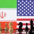 A photo illustration depicts chess pieces and the Iranian and U.S. flags - source: Reuters