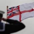 A British sailor salutes the Royal Navy flag - source: Department of Defense