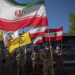 Flags of Iran, Hezbollah, and Lebanon are seen at a Quds Day celebration in Tehran - source: Reuters