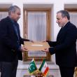 Pakistani and Iranian foreign ministers exchange documents relating to a U.S.-Iranian memorandum of understanding in Islamabad - source: Reuters