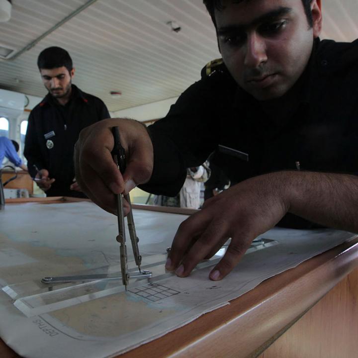 Iranian sailors on board a naval vessel in the Strait of Hormuz