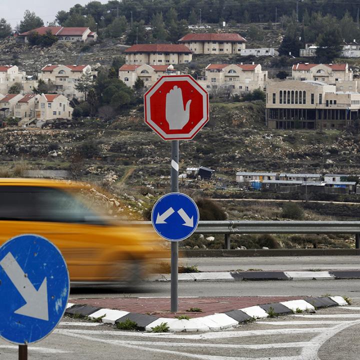 Traffic passes the Israeli settlement of Efrat in the West Bank