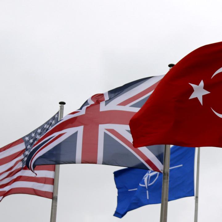 The flags of Turkey, the United States, United Kingdom, and NATO in Brussels