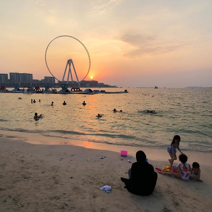 An Emirati family relaxes on the shore in Dubai