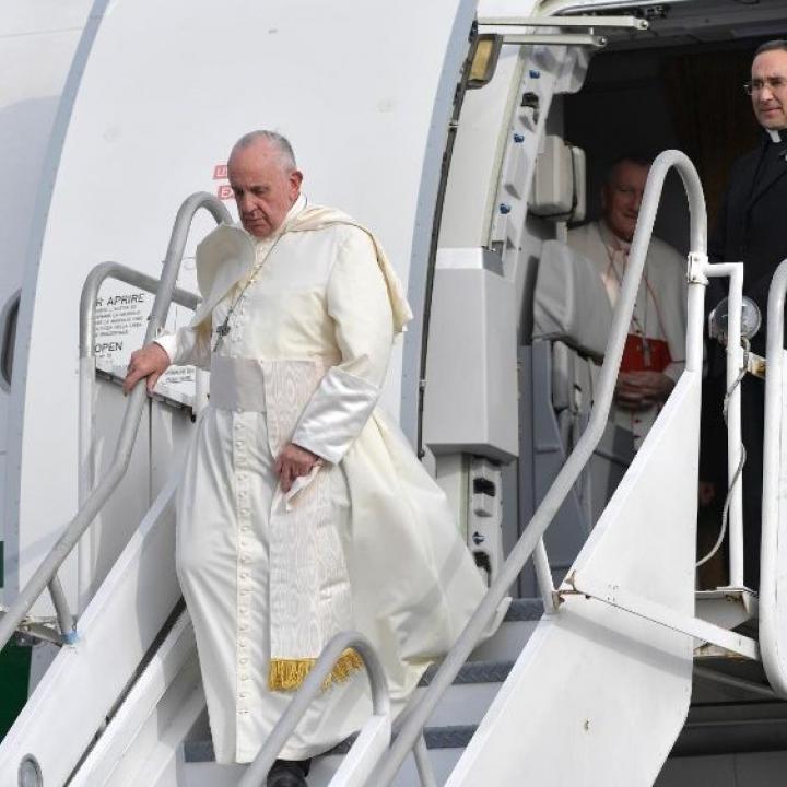 Pope Francis departs an airplane