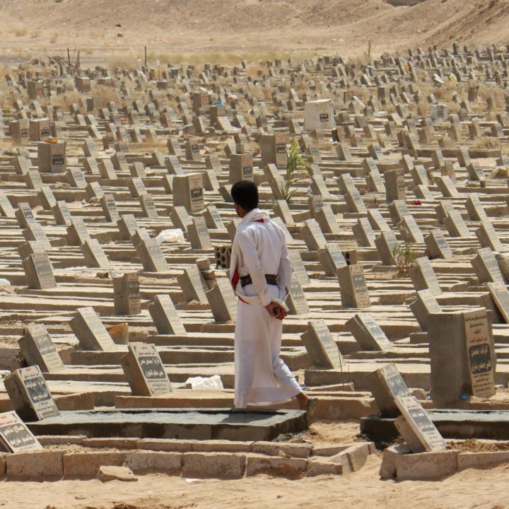 A man walks in a graveyard in Marib, Yemen