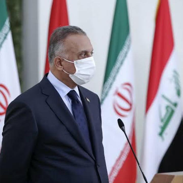 Kadhimi with Iranian and Iraqi flags