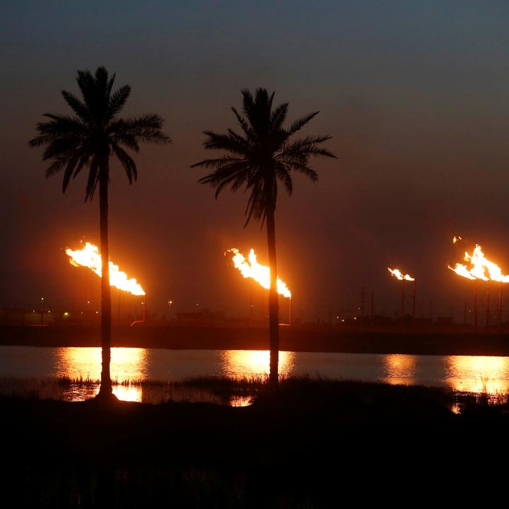 Flames emerge from flare stacks at Nahr Bin Umar oil field, north of Basra, Iraq - source: Reuters