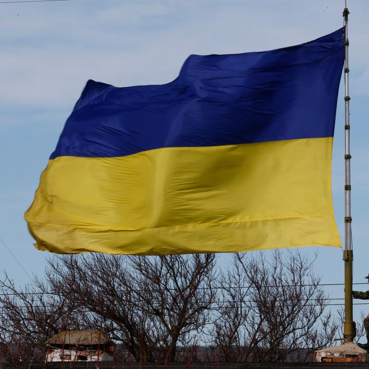 A Ukrainian flag flies at a naval base in Crimea in 2014 - source: Reuters