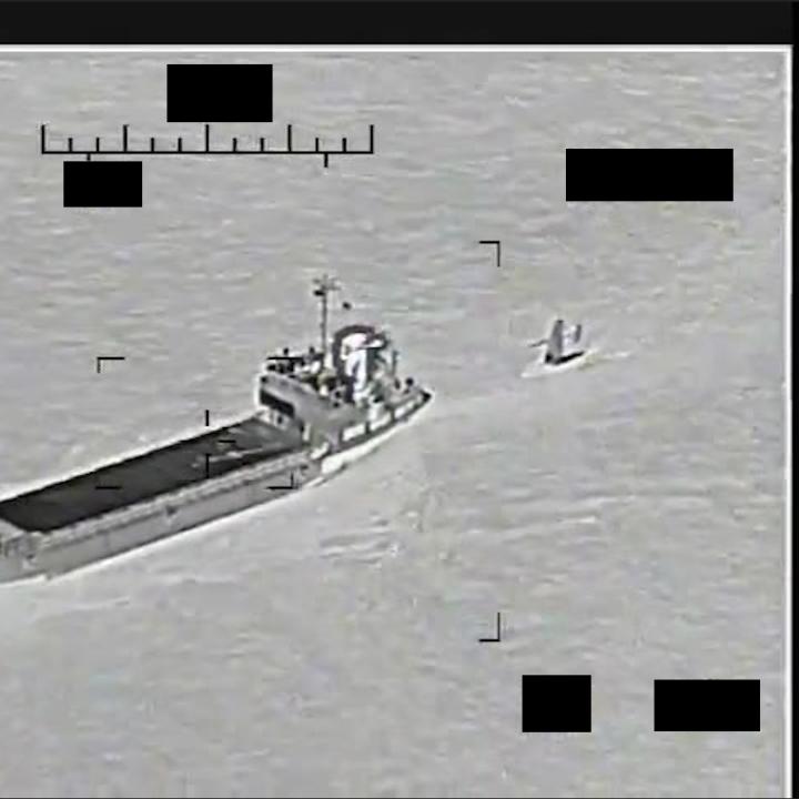 U.S. Navy image of an Iranian vessel attempting to capture a U.S. naval drone - source: Department of Defense