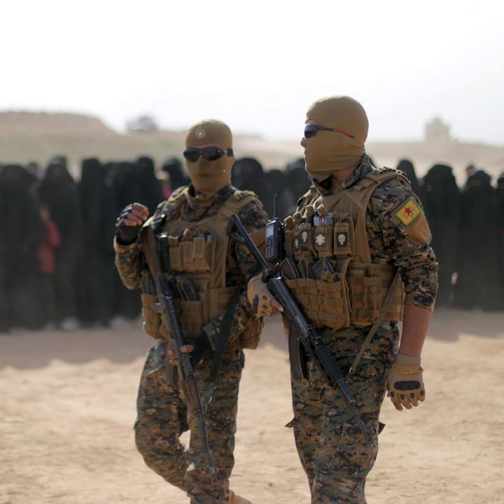 Fighters of Syrian Democratic Forces (SDF), walk together near Baghouz, Deir Al Zor province - source: Reuters