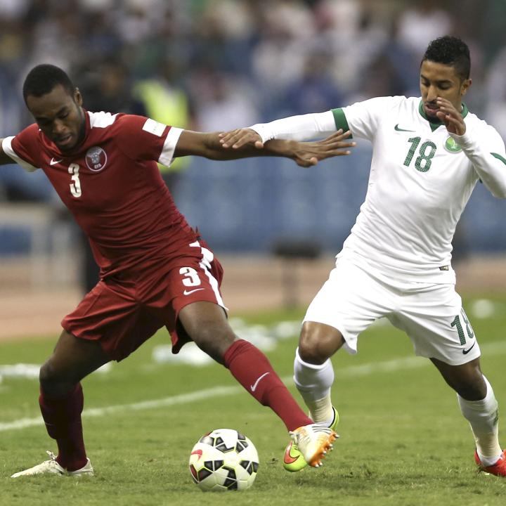 Qatari and Saudi soccer players in the 2014 Gulf Cup final game - source: Reuters