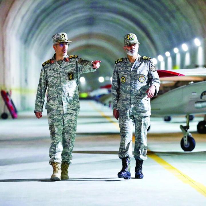 Iranian military officers, including Major General Bagheri, tour an underground air base - source: Iranian government