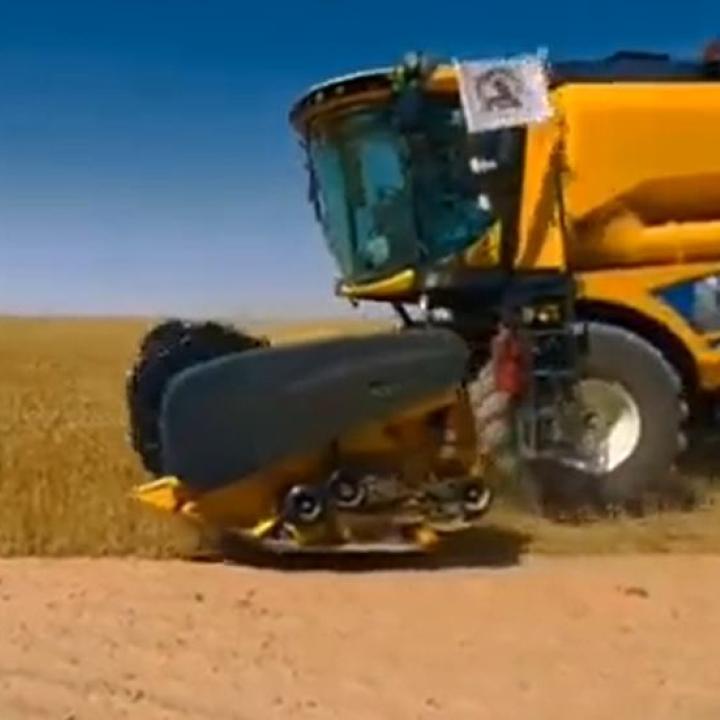 PMF logo on a Muhandis General Company combine harvester