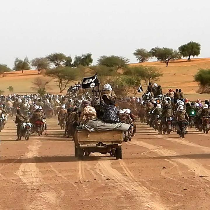 Islamic State forces, in convoy formation, declare allegiance to new caliph, 2023.