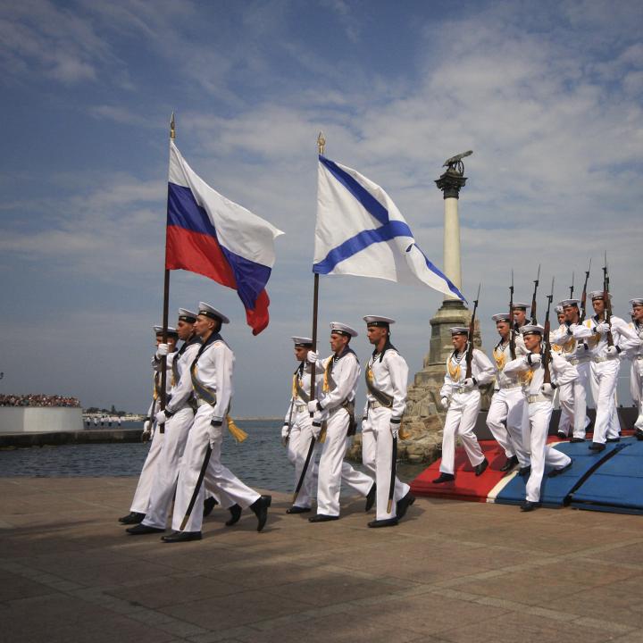 Russian sailors parade with their national and Navy flags in the port of Sevastopol in occupied Crimea - source: Reuters