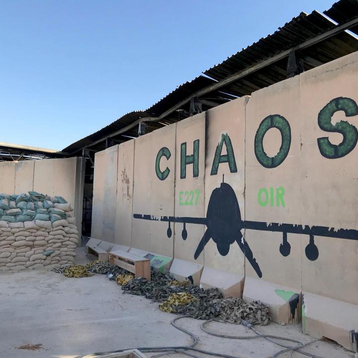 Photo of a blast wall with a drone mural at al-Asad Air Base in Iraq.