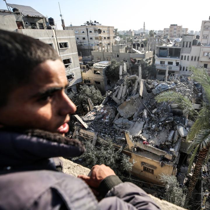 A Palestinian views a building reduced to rubble in Gaza - source: Reuters