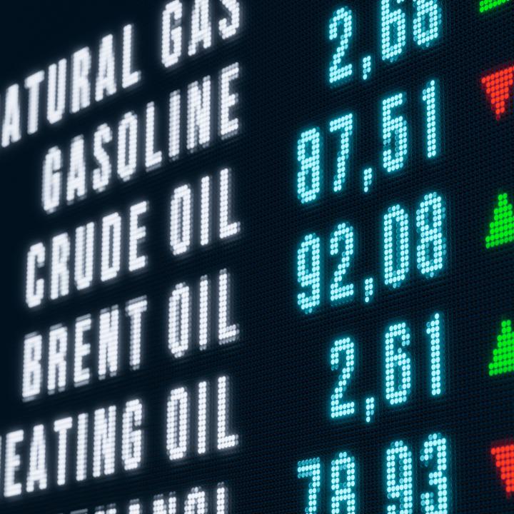 A video board displays various oil and gas commodity prices in September 2023 - source: Reuters