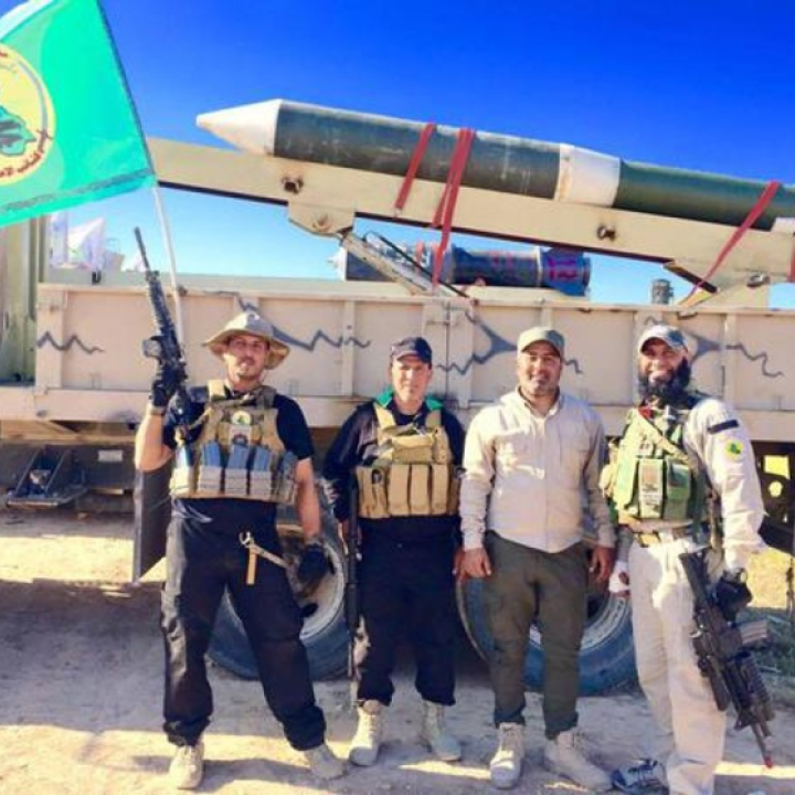 Kataib Al-Imam Ali fighters and an artillery rocket