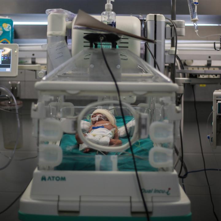 Photo of a Palestinian infant receiving care at a Gaza hospital.