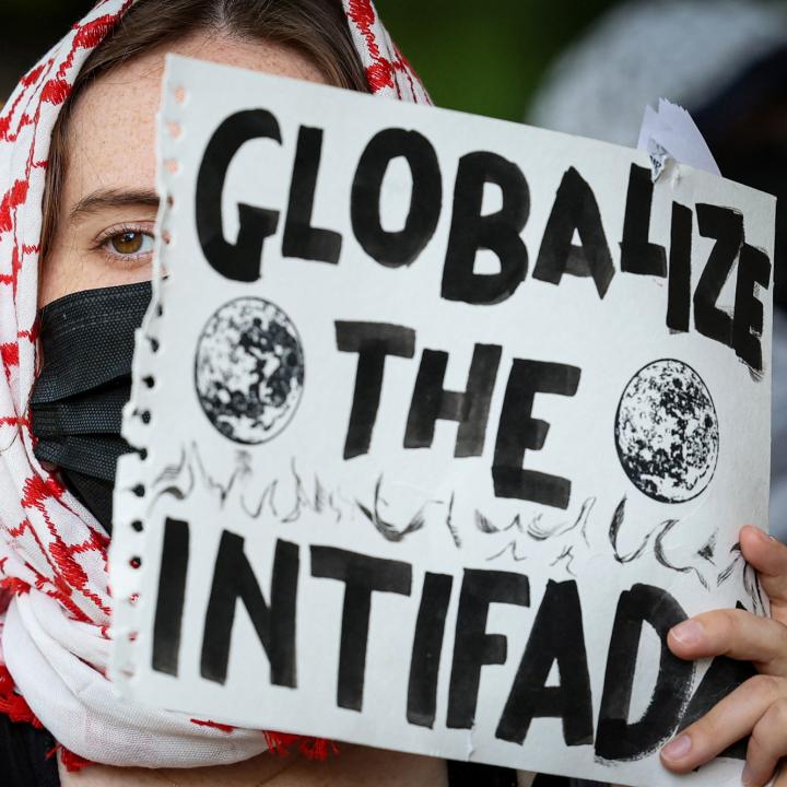 A student protester holds a sign reading "Globalize the Intifada" at Columbia University in New York City - source: Reuters