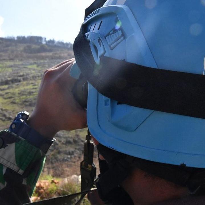 A United Nations peacepeeker scans the terrain in southern Lebanon - source: Untied Nations
