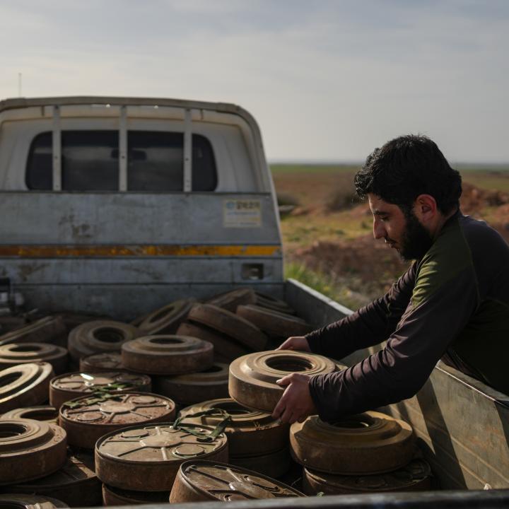 Photo of a Syrian soldier clearing landmines in Idlib province.