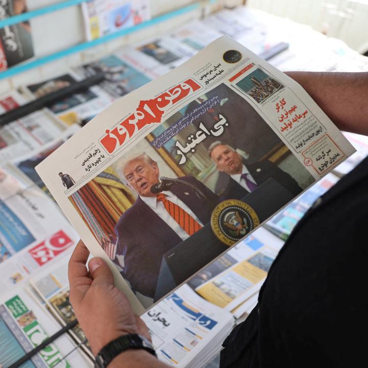 A man holds a newspaper featuring a photograph of U.S. President Trump and his Middle East advisor, Steve Witkoff, in Tehran - source: Reuters