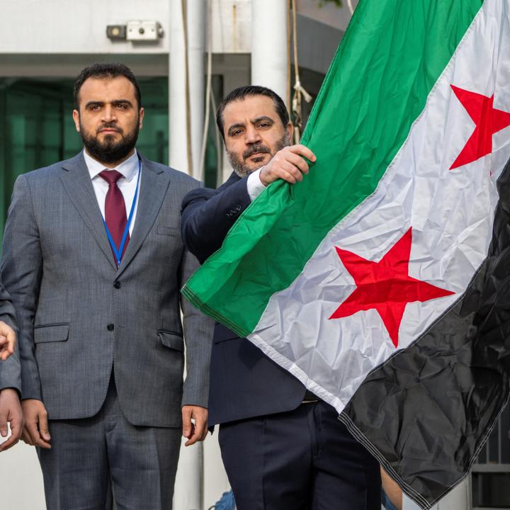Syrian Foreign Minister Asaad Hassan al-Shibani attends the ceremony of the new Syrian government flag being raised for the first time, outside United Nations Headquarters in New York, U.S., April 25, 2025 - source: Reuters