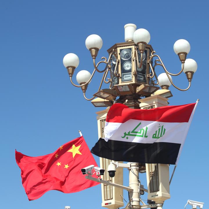 Chinese and Iraqi flags fly in Beijing during a state visit - source: Reuters