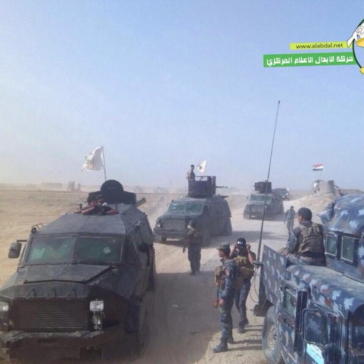 Harakat al-Abdal armored vehicles and flags