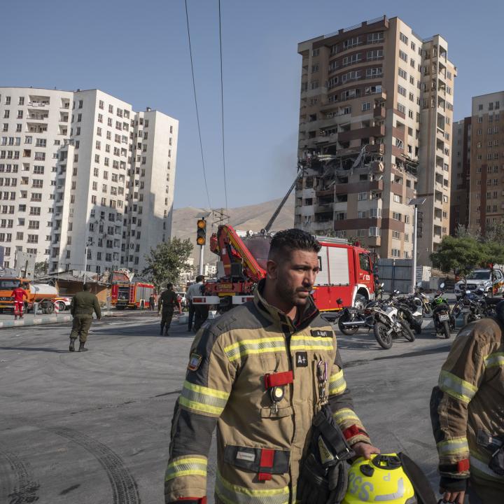 Emergency crews work at the scene of an Israeli air strike in Tehran in June 2025 - source: Reuters