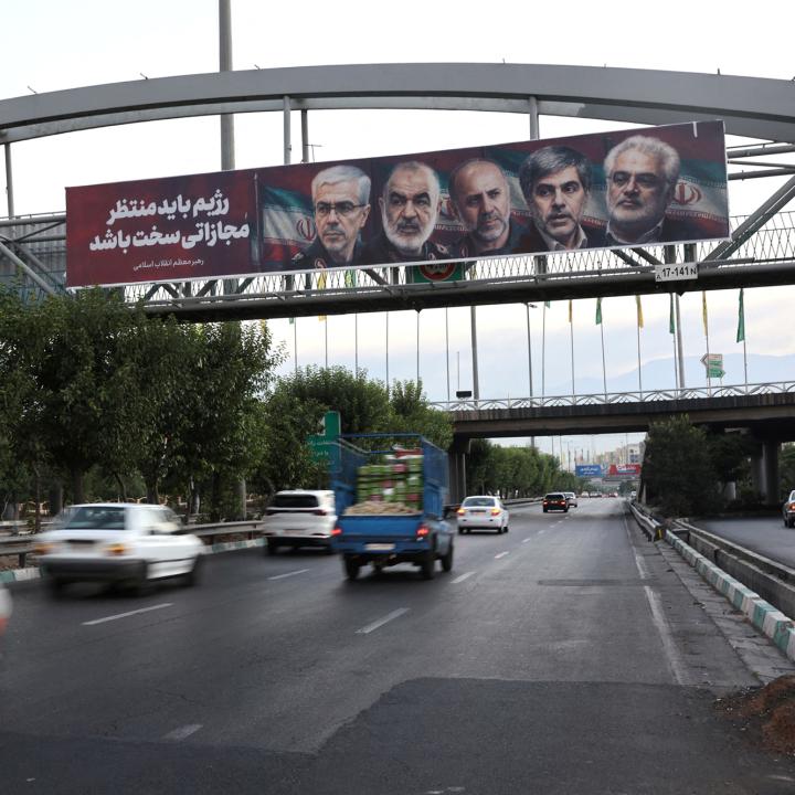 A highway bridge in Tehran displays images of nuclear scientists killed during Israeli strikes against Iran in June 2025 - source: Reuters