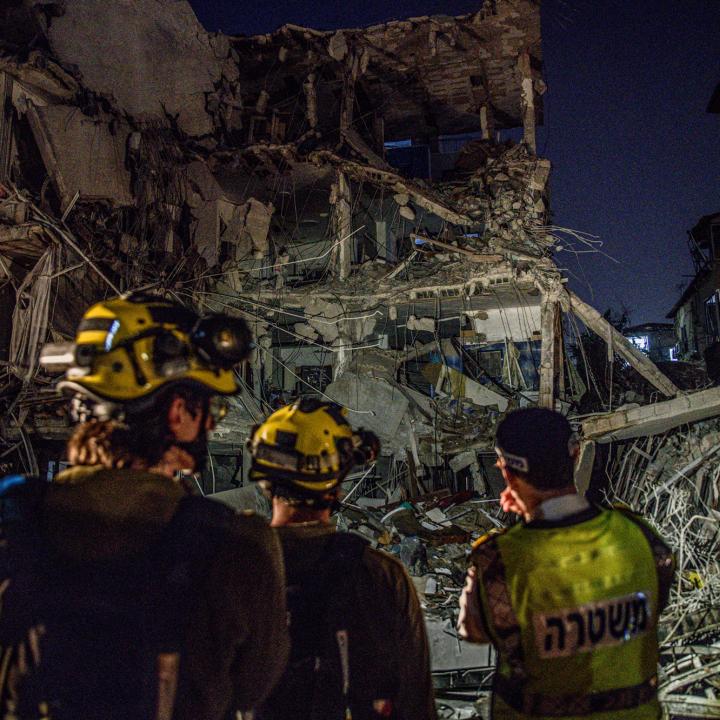 Israeli firefighters work at the site of in Iranian missile strike on a residential building in Tel Aviv in June 2025 - source: Reuters