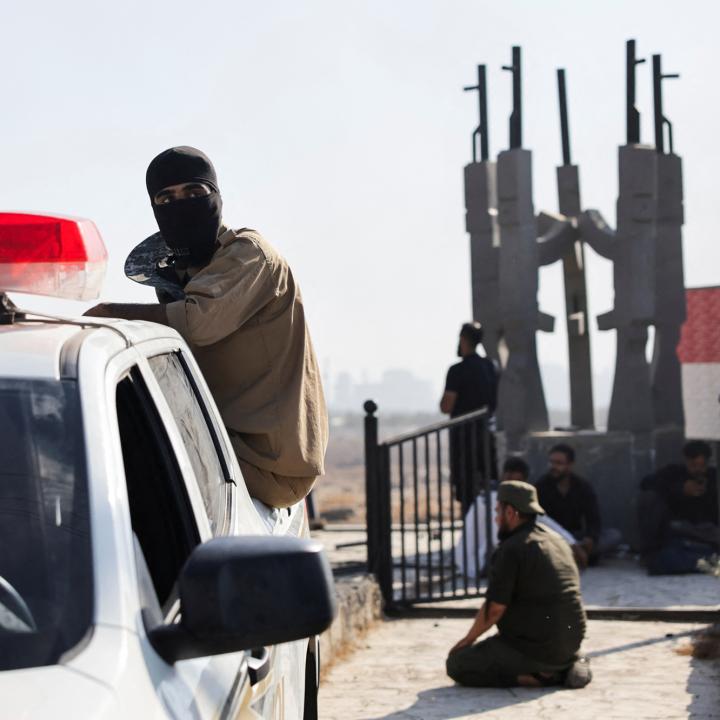 Bedouin fighters stopped at a government checkpoint near Suwayda in July 2025 - source: Reuters