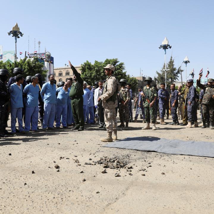 Soldiers stand guard next to men convicted of involvement in the 2018 killing of top Houthi leader Saleh al-Samad before their execution at Tahrir Square in Sanaa, Yemen in September 2021 - source: Reuters