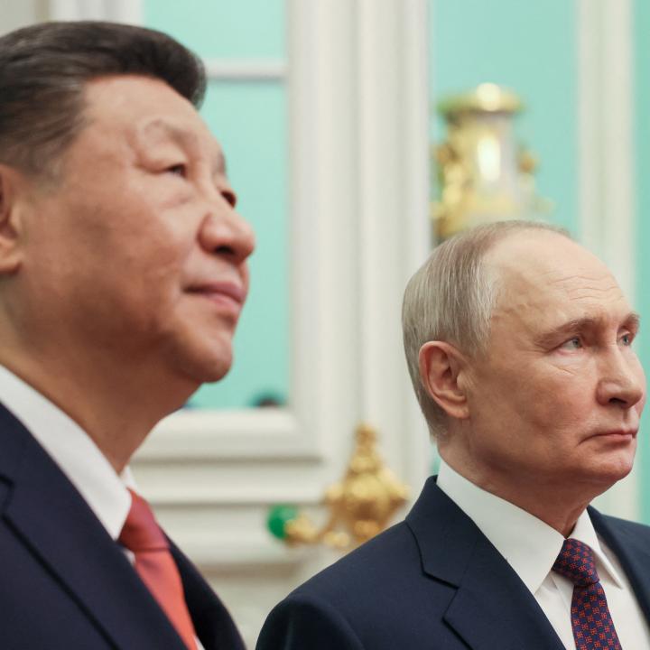 Close-up photo of Chinese leader Xi and Russian leader Putin.