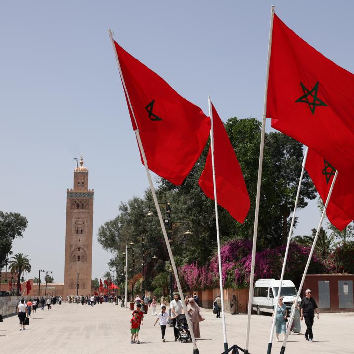 Moroccan flags fly in front of a mosque in Rabat - source: Reuters