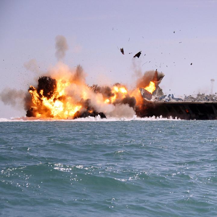 A tanker is destroyed as a test target during an Iranian naval exercise