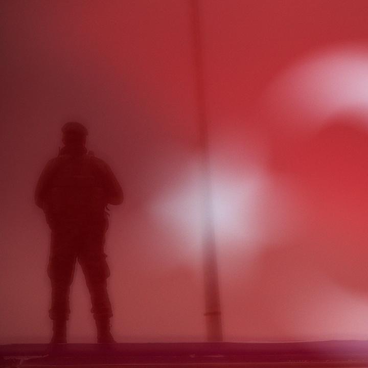 A Turkish soldier stands guard at a rally. Image source: Reuters