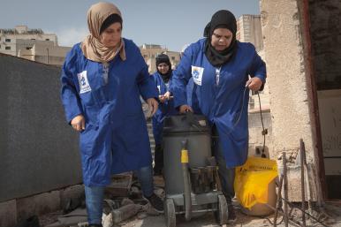 Women plumbers on rooftop