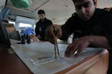 Iranian sailors on board a naval vessel in the Strait of Hormuz