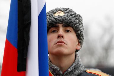 A Russian soldier and flag