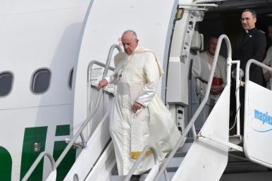 Pope Francis departs an airplane