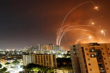 Iron Dome rockets intercepting Hamas missiles over Tel Aviv